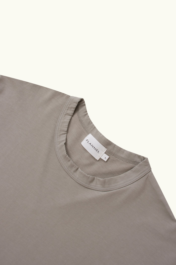 Oat cotton t-shirt on a plain background