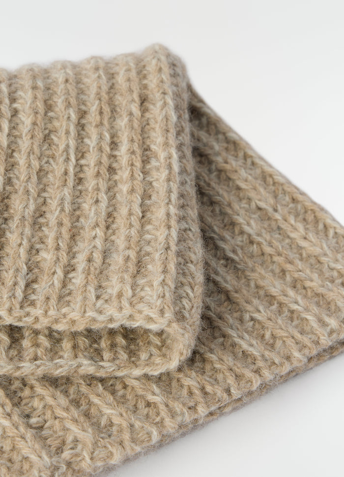 Neck warmer in beige alpaca and yak wool blend by LEMAIRE close-up detail on white background