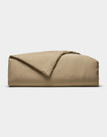 The Cozy Earth Soft-Wash Cotton Duvet Cover is shown folded with a corner turned back, set against a plain white background.|Color:Sandalwood