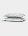 Two Cozy Earth Soft-Wash Cotton Quilted Shams in white with light blue and gray stripes are stacked together against a plain white background.|Color:River and Sea Salt Stripe