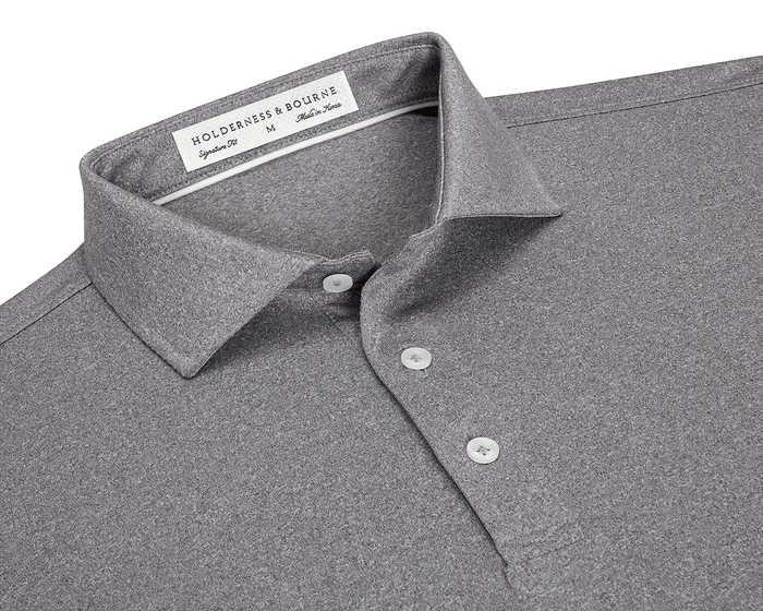 The Anderson Shirt: Heathered Gray features a classic collar, three-button placket, and jersey knit fabric for stretch and moisture-wicking comfort.