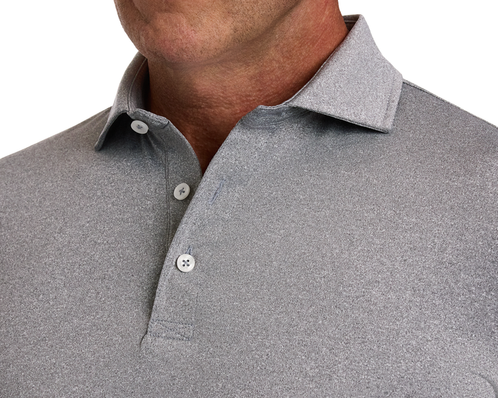 The Anderson Shirt: Heathered Gray—close-up of a man wearing a polo shirt featuring a two-button placket, folded collar, and fine textured fabric.