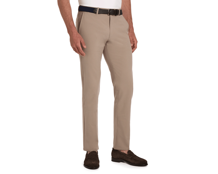 Model wearing The Anson Chino Pant: Fescue, showcasing slim-fit design with classic slant pockets, dark belt, and brown suede loafers.
