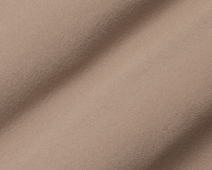 Close-up of The Anson Chino Pant: Fescue, showcasing its fine woven texture and wrinkle-resistant, eco-friendly fabric with four-way stretch for ultimate comfort.