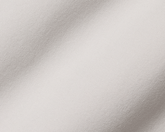 Close-up of The Anson Chino Pant's woven fabric, showcasing fine yarns and subtle texture, highlighting its wrinkle-resistant, quick-drying, eco-friendly, and stretchy performance.