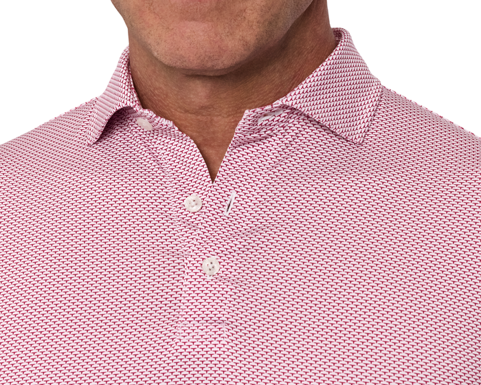 The Armfield Shirt: Liberty Red features a geometric pattern, fold-over collar, and two-button placket, offering comfort with its stretch jersey knit and structured fit.