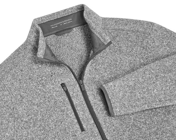 The Ashby Jacket: Heathered Gray, featuring a full-zip design, stand-up sherpa collar, and chest zip-pocket, offers versatile comfort with its buttery soft interior.