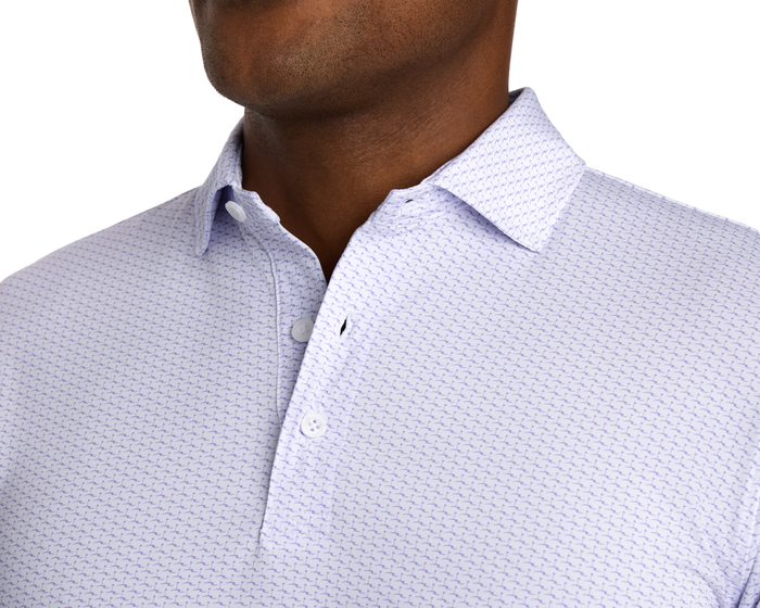 The Atwood Shirt: Tudor, showcasing a geometric print polo with a classic collar and unfastened placket, made from stretchy, moisture-wicking performance jersey.