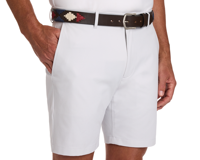 The Barker Belt: Brown/Navy/Claret/Stone with geometric embroidery accents light-colored tailored shorts, showcasing Argentinean-inspired patterns and premium craftsmanship.