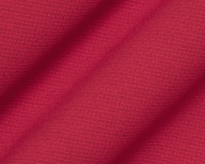 The Bell Quarter-Zip: Heathered Liberty Red features a close-up of its textured, breathable knit fabric, showcasing its sporty, sophisticated design and versatile performance.