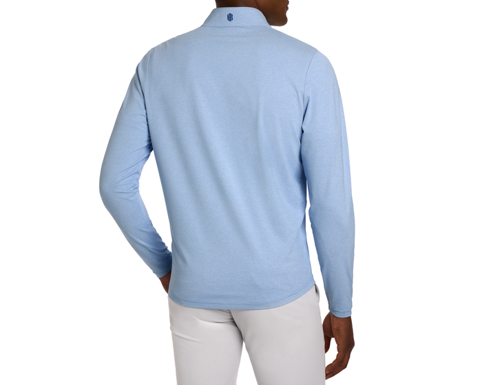Back view of person in The Bell Quarter-Zip: Heathered Vista Blue, showcasing the lightweight, breathable fabric and modern drop-tail silhouette with a subtle collar logo.