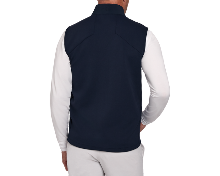 The Benton Vest: Navy, shown from the back, features a sleeveless design over a long-sleeve shirt, highlighting its lightweight fit and two-way zipper.