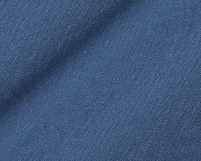 Close-up of The Boyd Vest: Andover, showcasing its woven fabric texture and gentle folds, highlighting its windproof and water-resistant design.
