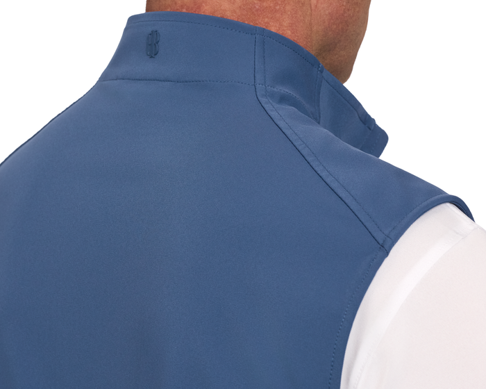 The Boyd Vest: Andover shown in a close-up, highlighting its sleeveless design, raised collar, and shoulder seam stitching over a white shirt.