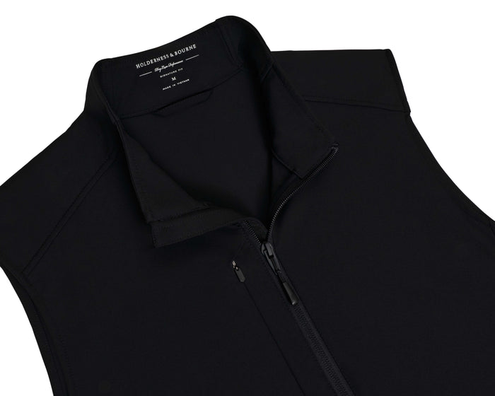 The Boyd Vest: Black, a sleek, black windbreaker with a stand-up collar and two-way zipper, features windproof, water-resistant fabric with four-way stretch for flexibility.