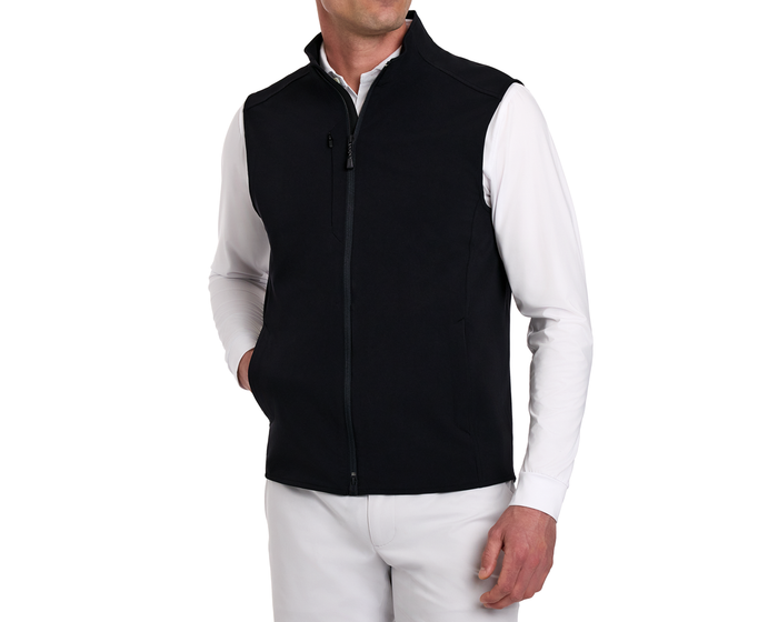 The Boyd Vest: Black on a model, showcasing its sleek design with a high collar, chest zip pocket, and functional two-way zipper over a white shirt.