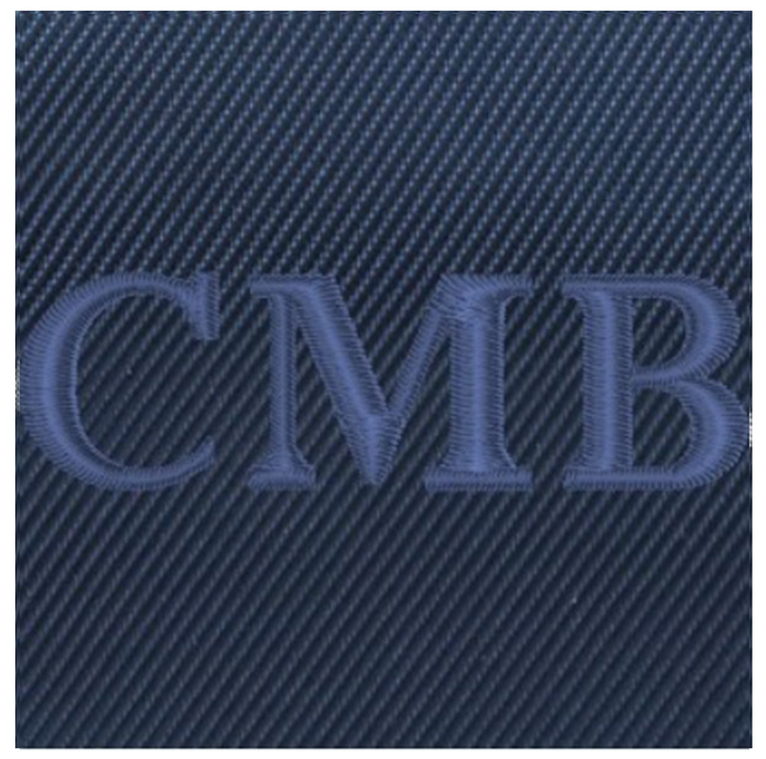 The Broughton Backpack: Navy Ballistic - Navy Embroidery, showcasing C M B initials on dark blue twill fabric, emphasizing its personalization feature.