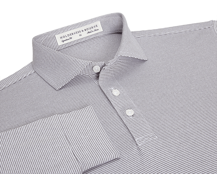The Burke Shirt: Gray & White, featuring narrow stripes, a structured spread collar, three-button placket, cuffed sleeve, and Holderness & Bourne label, offers UPF 50+ protection.