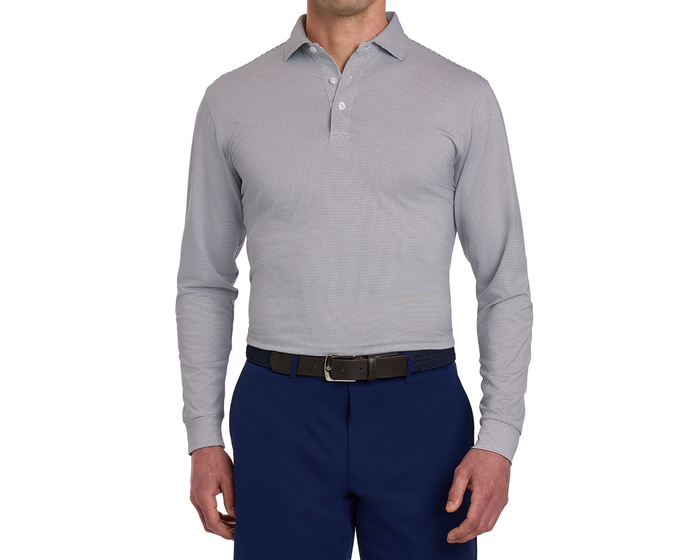 The Burke Shirt: Gray & White, a fine-striped, long-sleeve polo with UPF 50+ protection, classic collar, and moisture-wicking fabric, tucked into navy trousers.