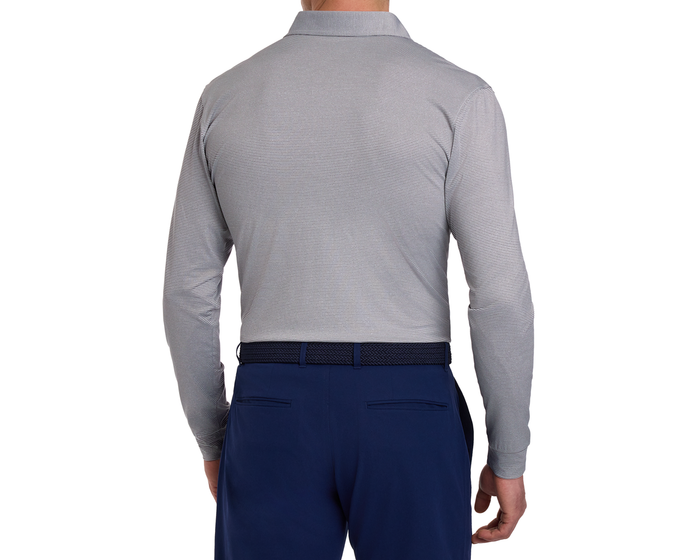 The Burke Shirt: Gray & White, shown from the back with fine stripes, long sleeves, tucked into navy trousers with a braided belt.