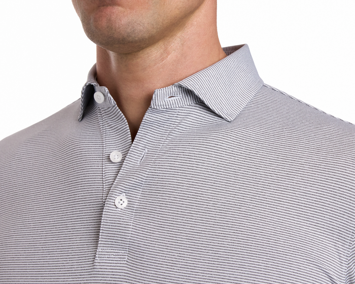 The Burke Shirt: Gray & White, close-up of striped polo with two-button placket, unstructured collar, highlighting its sun protection and moisture-wicking features.