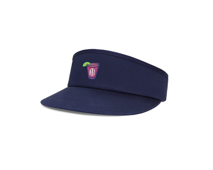 The Cocktail Tour Visor: Navy with Transfusion Icon features a brimmed headband style cap with a pink drink motif, adjustable buckle, and moisture-wicking sweatband.