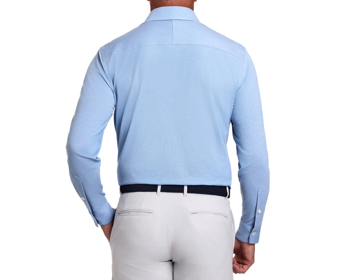 Man wearing The Cullinane Shirt: Heathered Vista Blue, showcasing its smart-casual style with a structured spread collar and breathable, stretchable fabric.