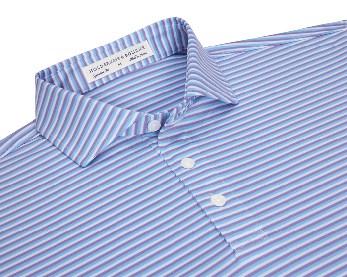The Fleming Shirt features narrow horizontal stripes, a structured collar, and a three-button placket, offering comfort with moisture-wicking and UPF 50+ protection.