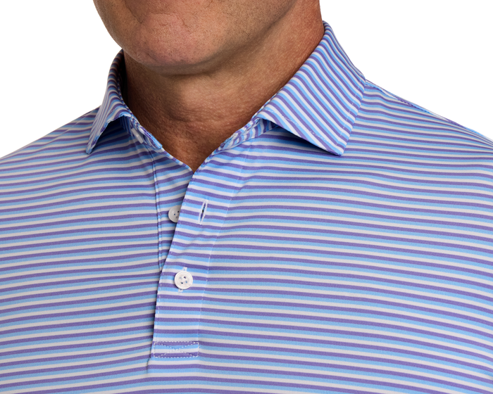 Close-up of The Fleming Shirt: Tudor/Vista Blue/White, featuring narrow stripes, short sleeves, and two visible buttons, highlighting its soft, breathable, and sun-protective fabric.