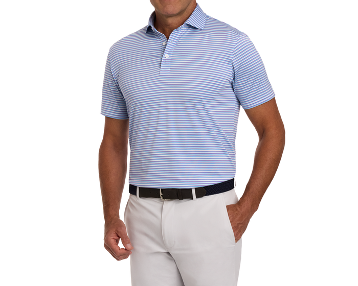 The Fleming Shirt in Tudor/Vista Blue/White, featuring narrow stripes and a structured collar, paired with light trousers and a dark woven belt.