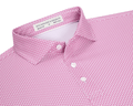 The Hanover Shirt: Cabernet, showing a close-up of the collar and placket with mother-of-pearl buttons, features a pink geometric jet pattern and label details.