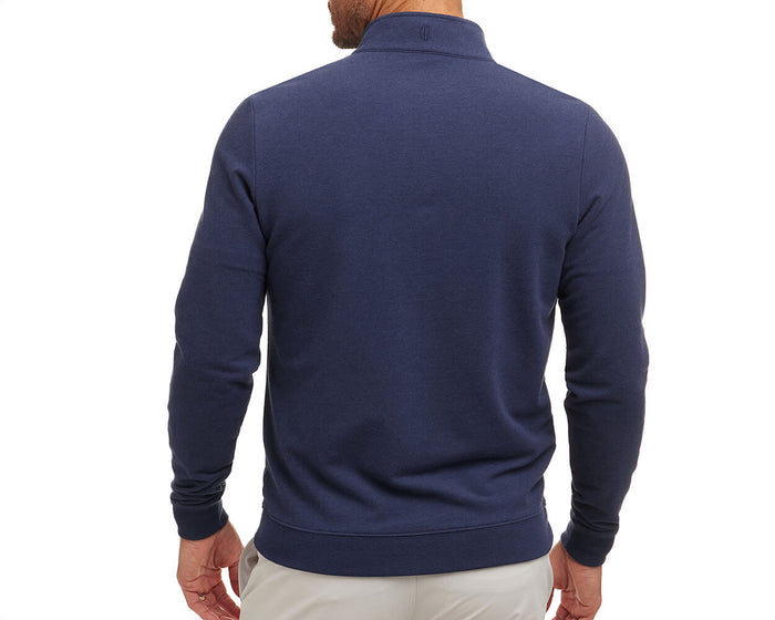 Back view of a man wearing The Harper Quarter-Zip: Heathered Atlantic, showcasing its ribbed cuffs and hem, highlighting the pullover's stylish design and comfortable fit.