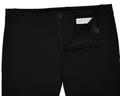 The Harwood Short: Black, displayed with a partly open zipper and undone button, revealing a Holderness & Bourne label and size 32 inside the waistband.