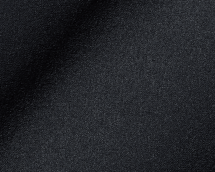 Close-up of The Harwood Short: Black, showcasing its dark, tightly woven fabric with a slight drape, highlighting the soft, stretchable performance material.