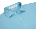 The Hatcher Shirt: Harbor & White features a folded collar, two white buttons, and a label indicating its signature fit and Peruvian cotton craftsmanship.