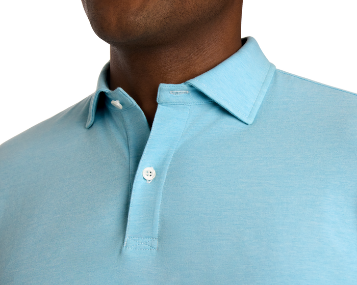 Close-up of The Hatcher Shirt: Harbor & White, showcasing a light-blue collared design with white buttons, made from breathable, stretchy Peruvian Pima cotton for comfort.