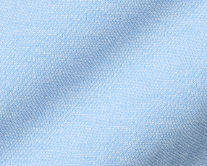 Close-up of The Hatcher Shirt in Vista Blue & White, showcasing fine knit stitches and fabric folds, highlighting its soft, breathable Peruvian Pima cotton blend.