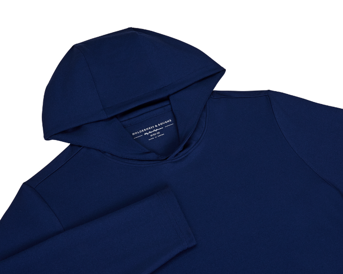 The Jackson Boys Hoodie: Navy, features a soft, lightweight design with a visible hood and sleeve, crafted from high-performance stretch fabric with UPF 50+ protection.
