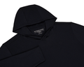 The Jackson Hoodie: Black, a sleek, lightweight pullover with no drawstrings or pouches, ideal for golf, displayed flat with visible Holderness & Bourne label.