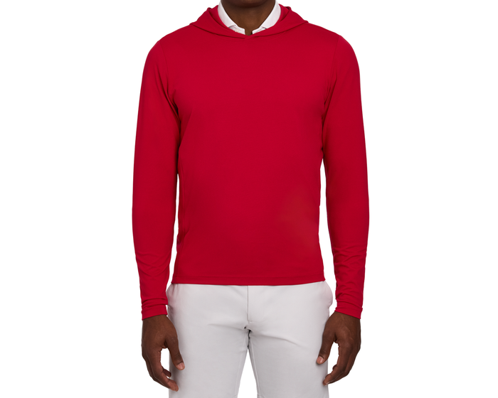 The Jackson Hoodie: Liberty, a lightweight red hoodie with streamlined design, shown on a person, highlighting its soft fabric and modern-classic style.