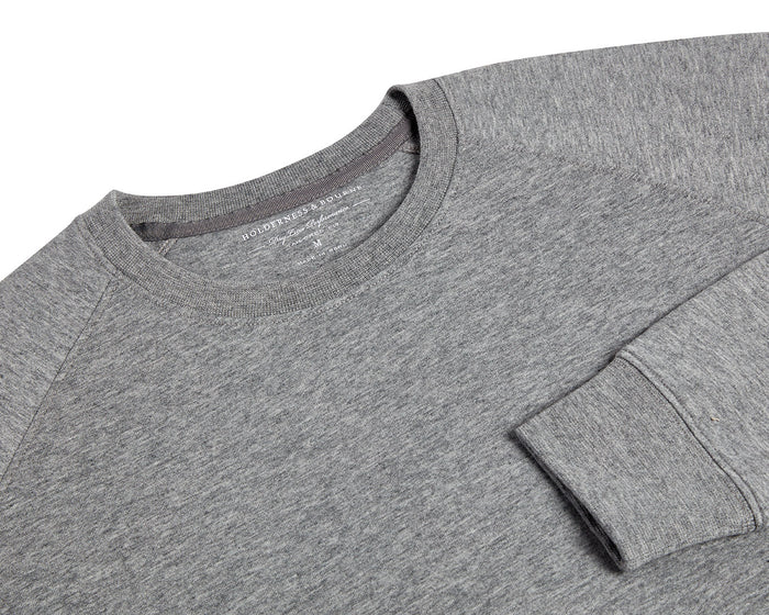 The Kennedy Crewneck: Heathered Gray, featuring a crew-neck design with visible collar, shoulder seams, and cuff, crafted from a soft cotton blend with terry interior.