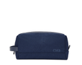 The Littler Dopp Kit: Navy Ballistic - Navy Embroidery, a sleek navy travel toiletry bag with a leather handle, top zipper, and debossed CMB initials.