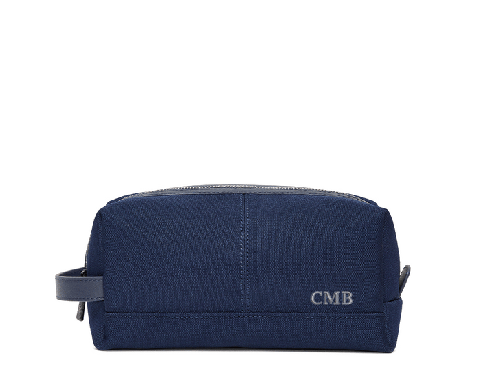The Littler Dopp Kit: Navy Ballistic - Slate Blue Embroidery, featuring a monogram, top zipper, side handle, and water-resistant interior and exterior.