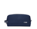 The Littler Dopp Kit: Navy Ballistic - White Embroidery, featuring a rectangular design with a top zipper, side handle, and personalized initials CMB.