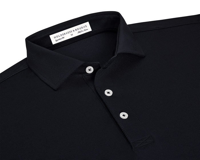 The Macdonald Shirt: Black, featuring a three-button placket, spread collar, and contrast piping, offers breathable comfort with its lightweight synthetic and stretch fibers.
