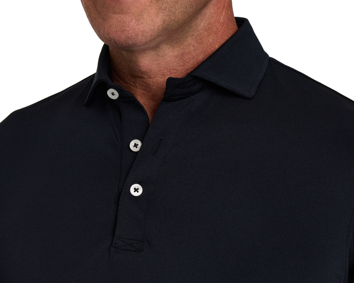 Person wearing The Macdonald Shirt: Black, featuring a dark navy collar, three white buttons, and a structured spread collar with contrast piping for modern elegance.