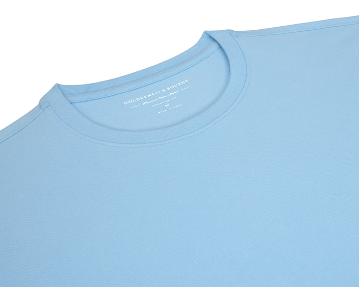 The Mason T-Shirt: Vista Blue, light-blue crew-neck featuring Holderness & Bourne branding, crafted from a premium Peruvian pima cotton blend for comfort and durability.