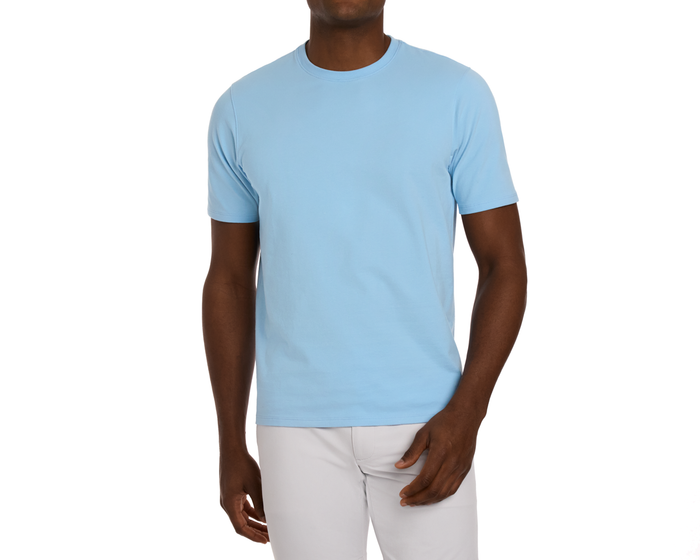 The Mason T-Shirt: Vista Blue, shown on a male model, features a light-blue, crew-neck style with short sleeves, highlighting its comfortable and durable Peruvian pima cotton blend.