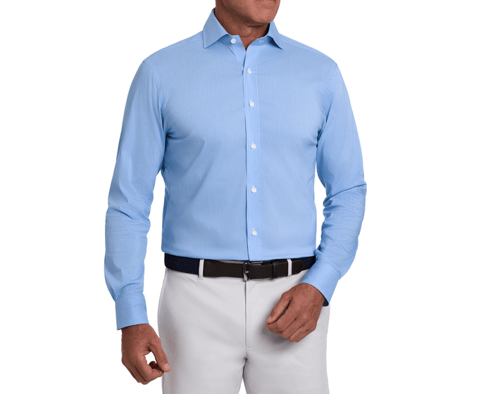 The McAllister Shirt: Horizon Blue, features a light-blue, fine-checked pattern, button-front, long sleeves, tucked into light trousers, with a dark woven belt.