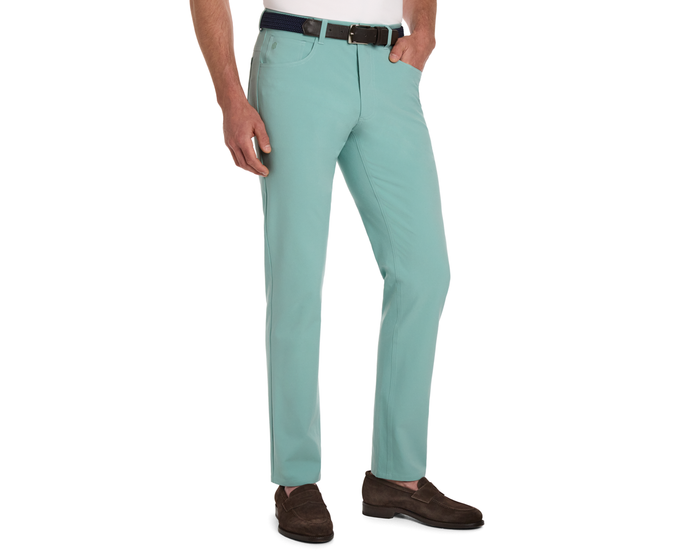 The McDaniel 5 Pocket Pant: Cascade Green, slim-fit trousers with five-pocket design, shown with a belt and brown loafers, highlighting comfort and versatility.